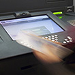  A customer counts banknotes at an ATM in Brussels, Belgium, April 2011 © EPA/ Horacio Villalobos